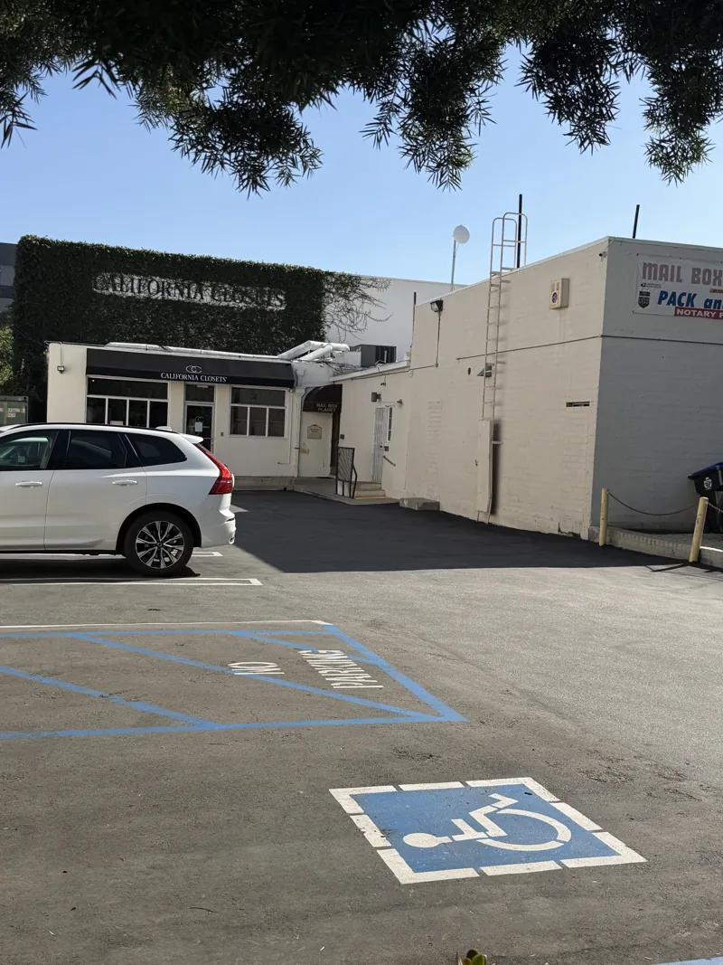 Parking area behind Mailbox Planet on South Lake Avenue